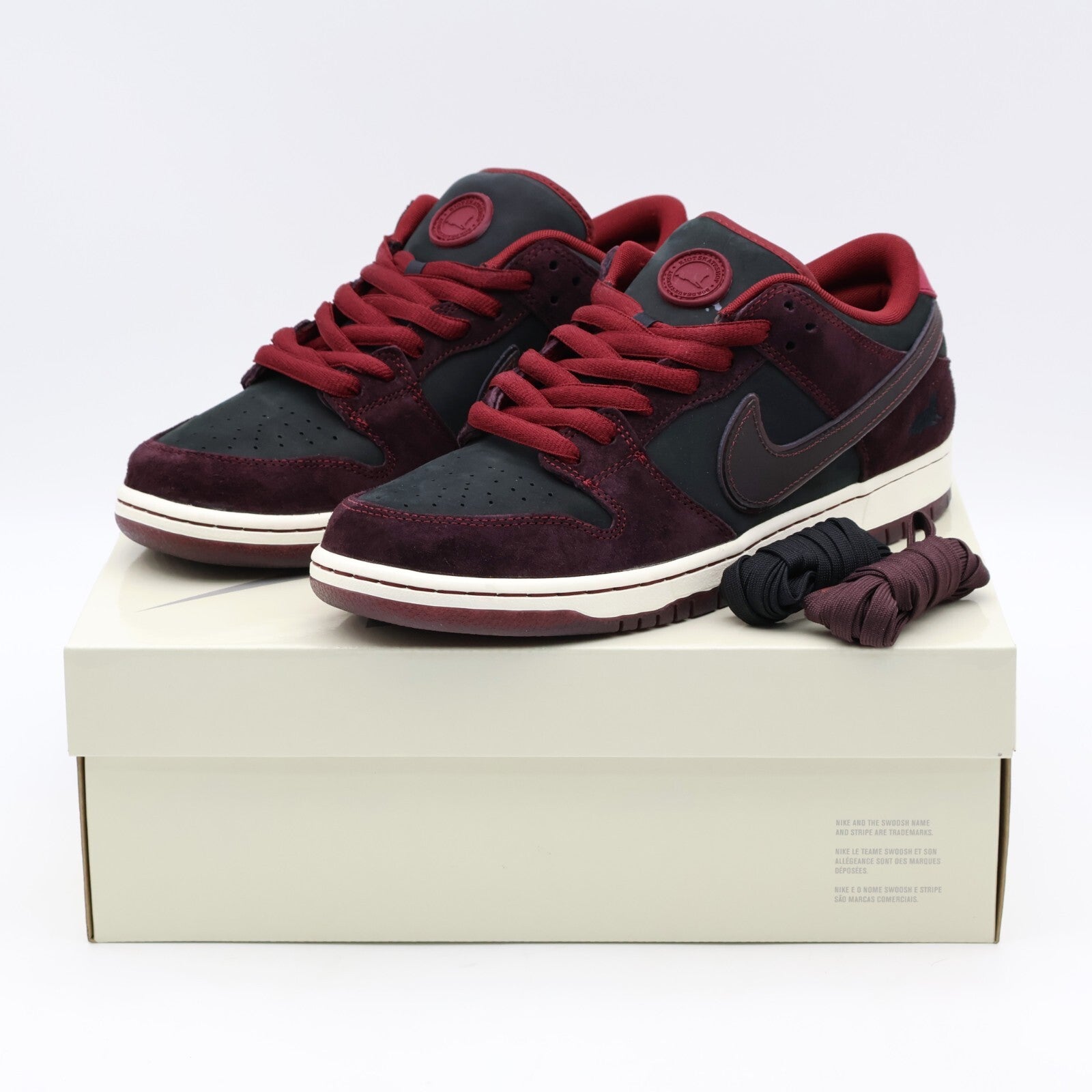 FZ1289-200 Riot Skateshop Nike SB Dunk Low Pro QS Mahogany and Team Red (Men's)