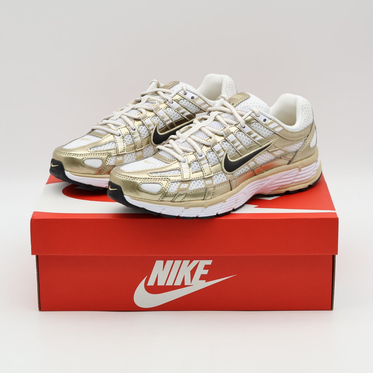 IF1787-100 Nike P-6000 Gold (Women's)