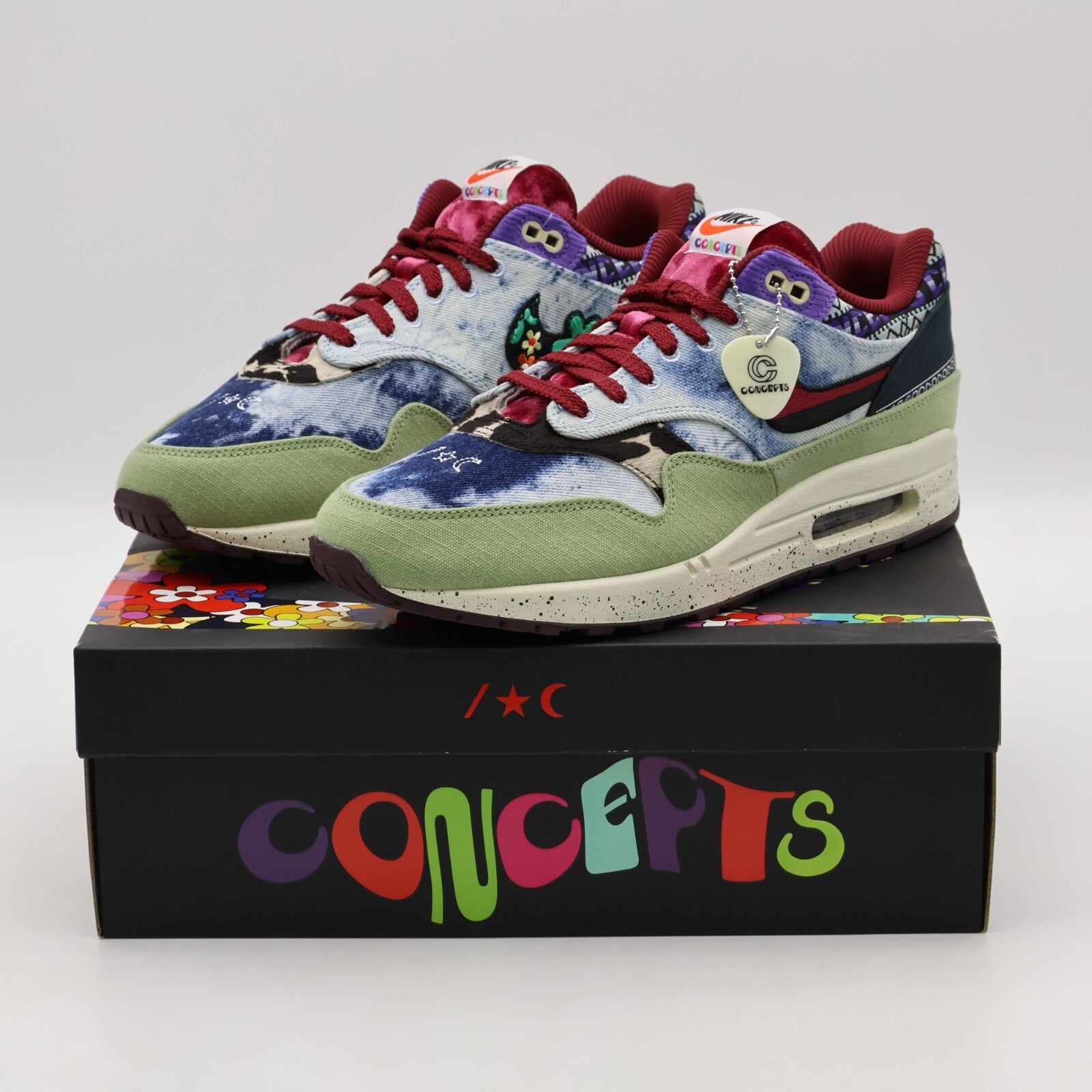 DN1803-300 Concepts Nike Air Max 1 Mellow Oil Green Black Team Red Sail (Men's)