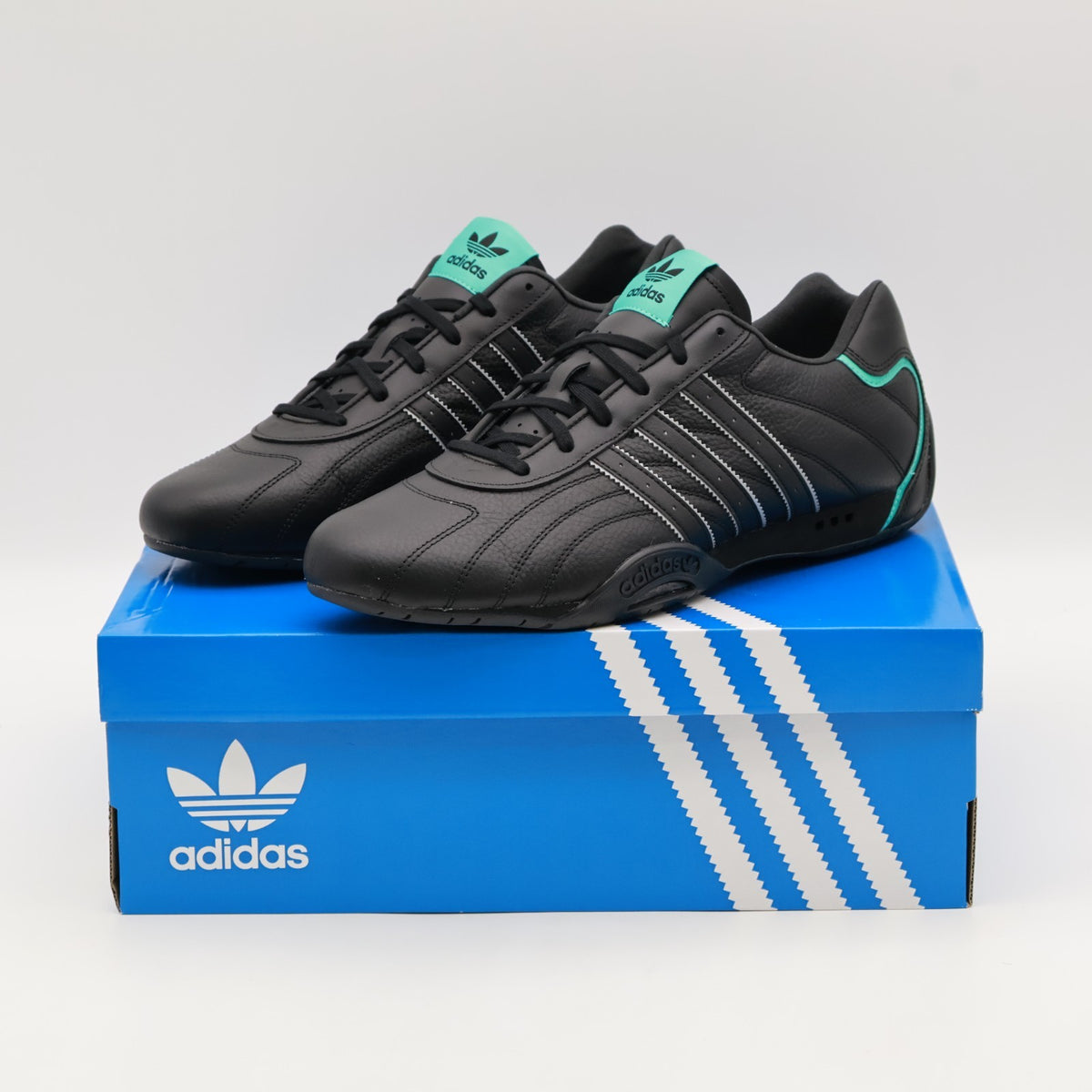 JR4543 Mercedes AMG PETRONAS F1 Team adidas Adiracer Lo Core Black Semi (Men's)