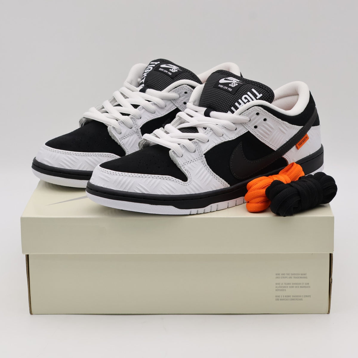 FD2629-100 TIGHTBOOTH Nike SB Dunk Low Pro QS Black White Safety Orange (Men's)