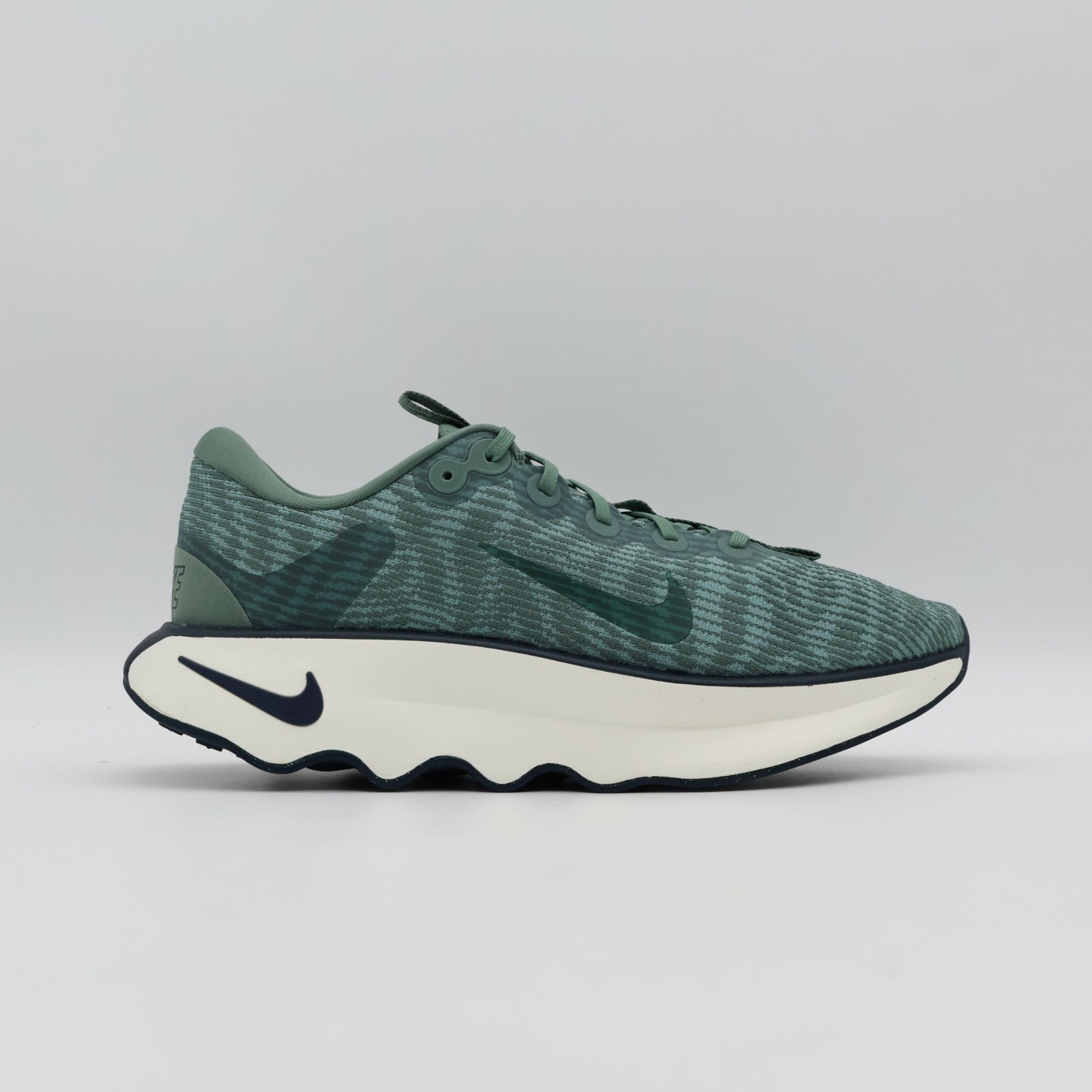 DV1237-301 Nike Motiva Clay Green Cannon Armory Navy Clay Green (Men's)