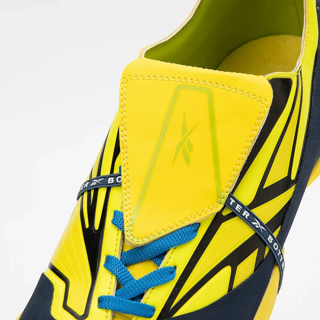 R04722BM00035 BOTTER Reebok Energia Bo Kets Yellow Blue (Men's)