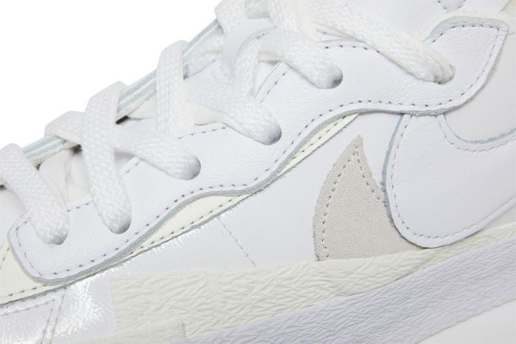 DM6443-100 sacai Ã Nike Blazer Low "White Patent Leather" (Men's)