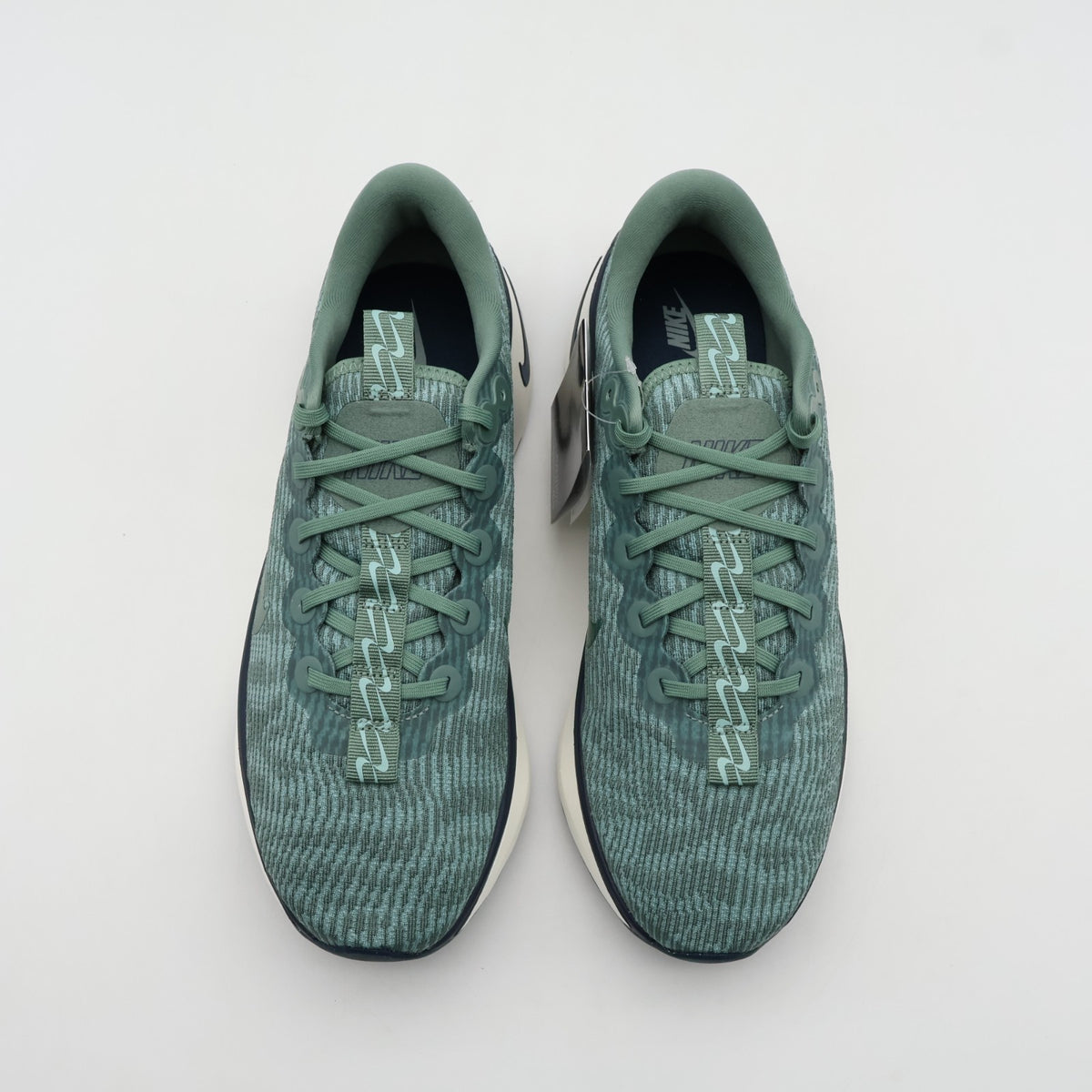 DV1237-301 Nike Motiva Clay Green Cannon Armory Navy Clay Green (Men's)