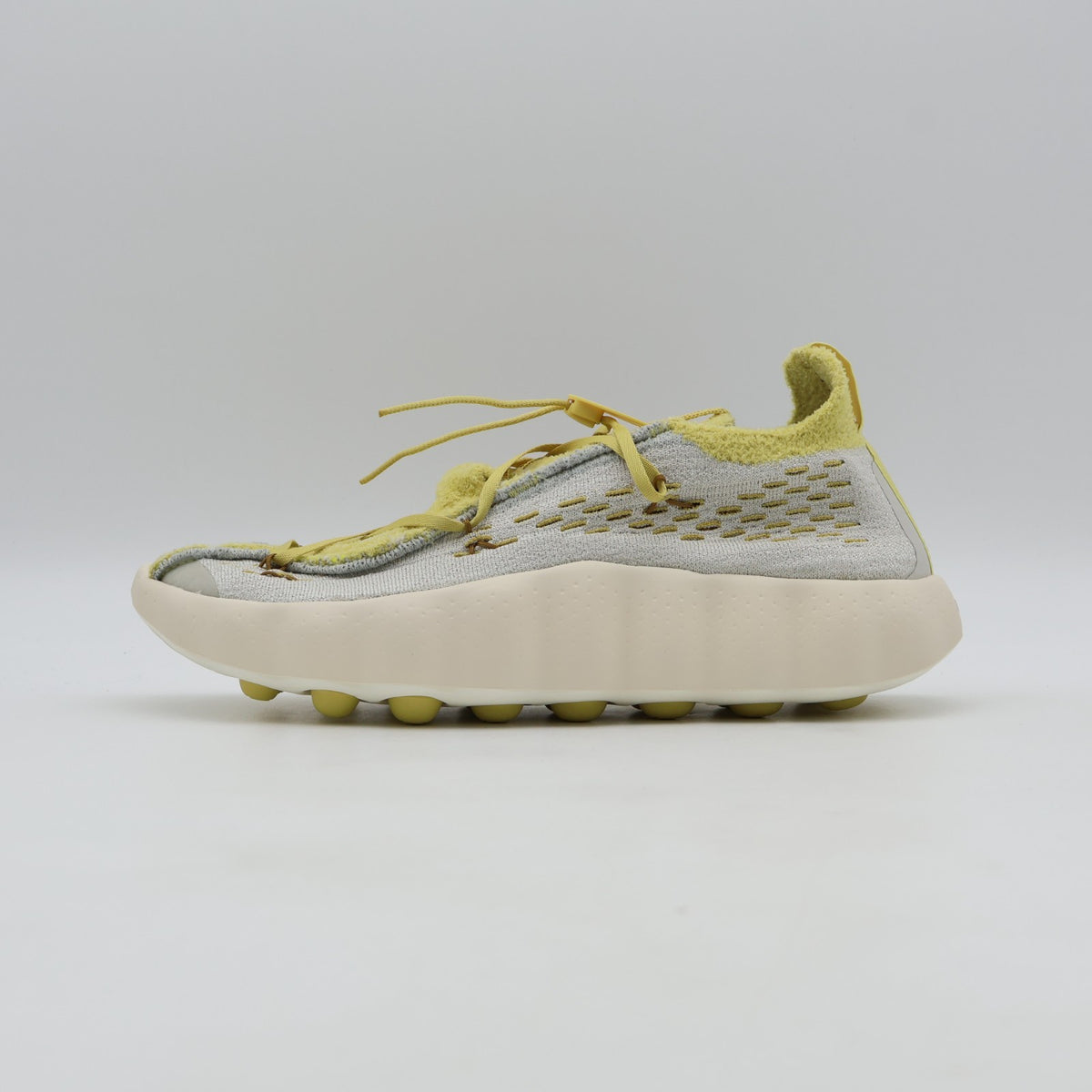 IR2176-003 Nike Mind 002 Flyknit Light Bone Saturn Gold (Men's)