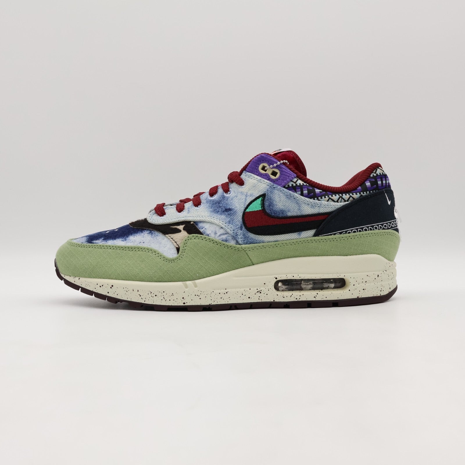 DN1803-300 Concepts Nike Air Max 1 Mellow Oil Green Black Team Red Sail (Men's)