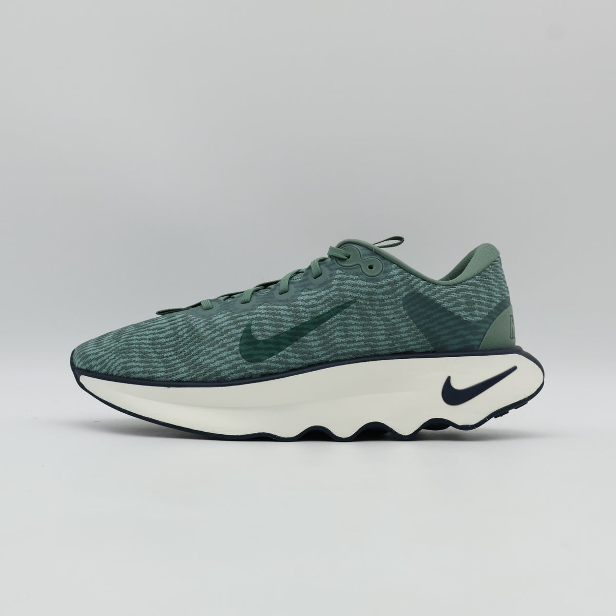 DV1237-301 Nike Motiva Clay Green Cannon Armory Navy Clay Green (Men's)