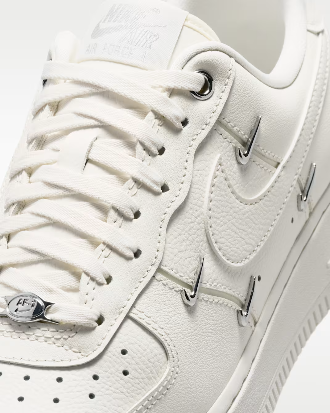IV4727-133 Nike Women's Air Force 1 '07 LV8 Sail/Metallic Silver (Women's)