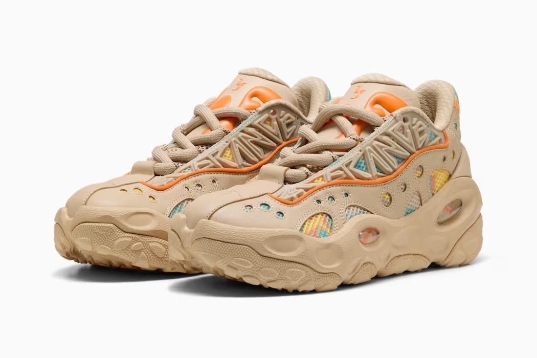 312165-01 LaMelo Ball Ã Puma La France RNR Light Sand Orange Glo Aquatic (Men's)