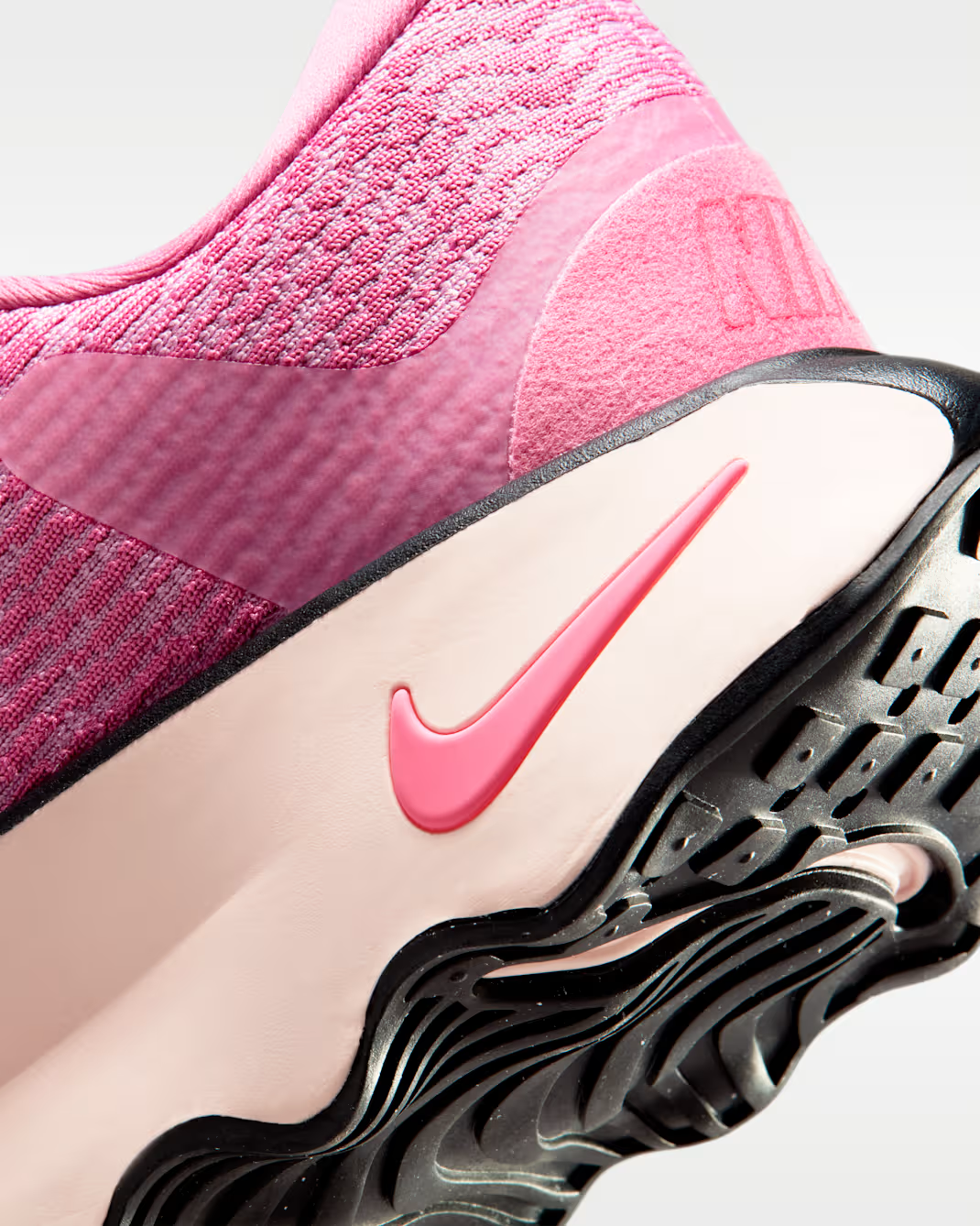 DV1238-606 Nike Motiva Peony Elemental Pink Purple Dynasty Sea Coral (Women's)