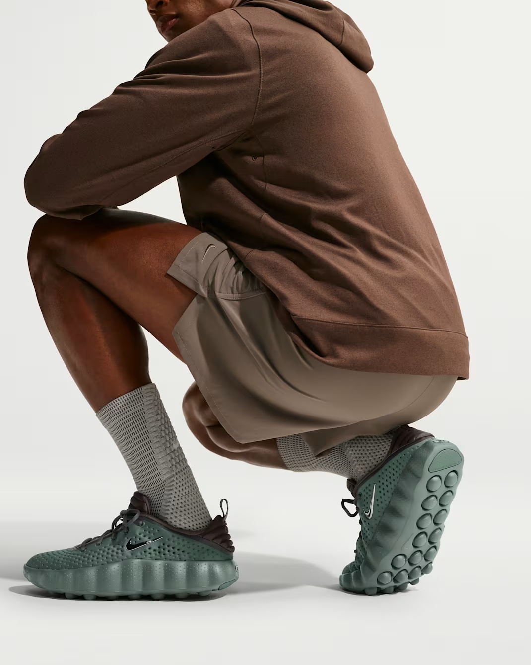 HQ4308-300 Nike Mind 002 "Camo Green/Newsprint" (Men's)
