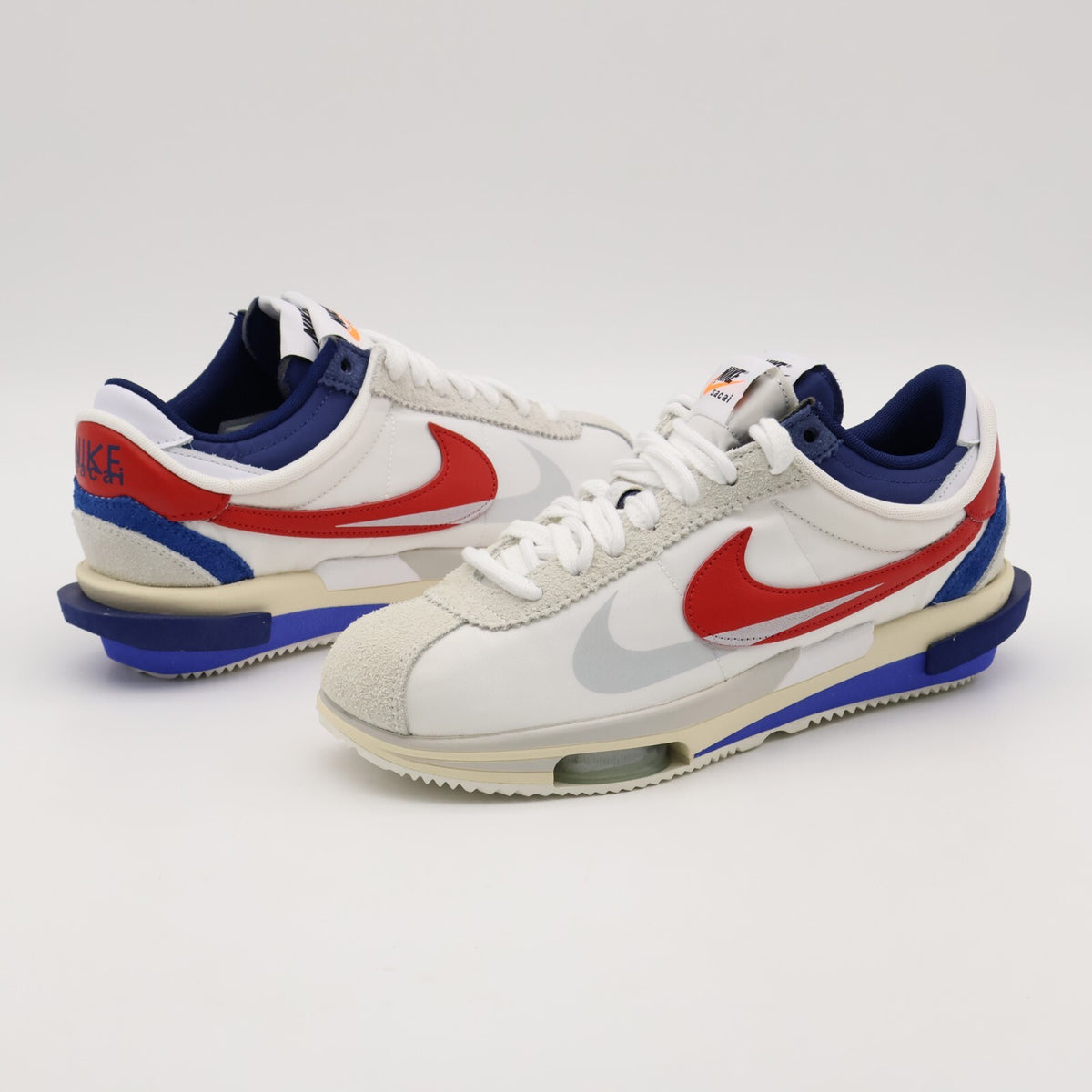 DQ0581-100 sacai Nike Zoom Cortez White University Red Blue Light Cream (Men's)
