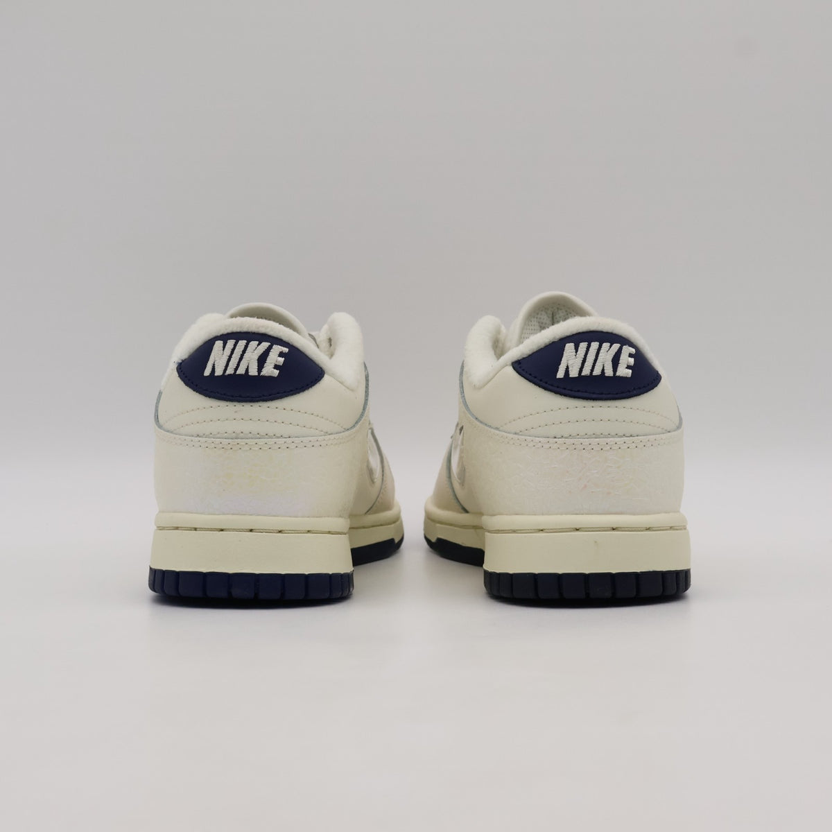 IM6571-027 Nike Dunk Low Mini Swoosh Soft Pearl (Women's)
